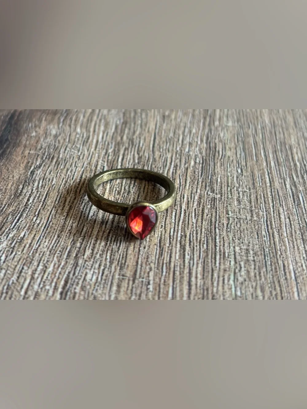 Fashion Jewelry Women’s size 10.5 brass tone pear shape red stone bezel ring